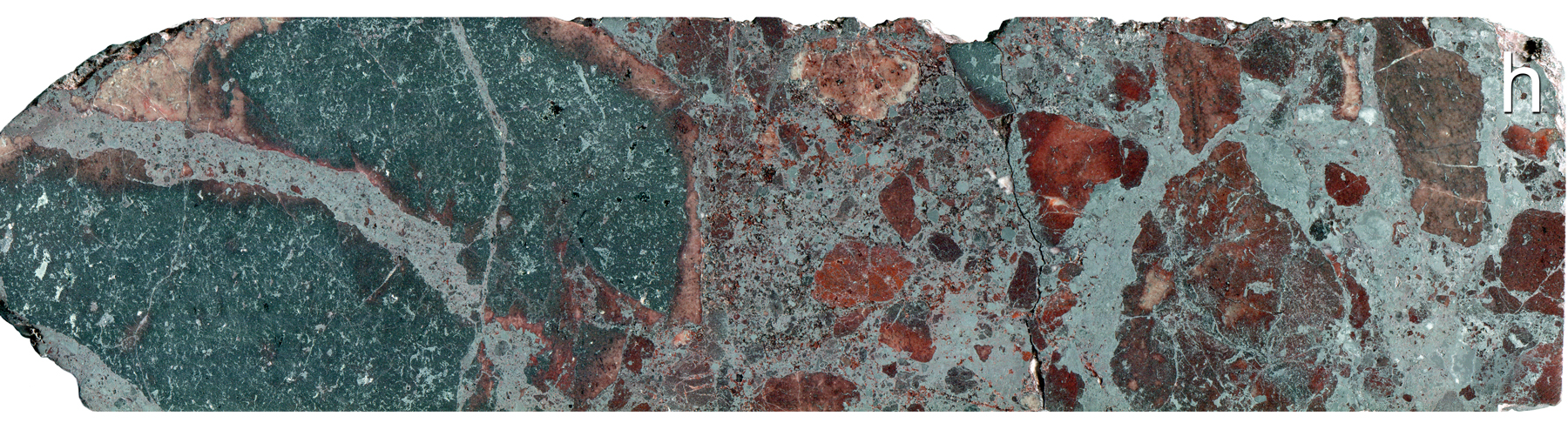 Hematite altered grey mudstone matrix conglomerate containing mafic, felsic and hematite clasts