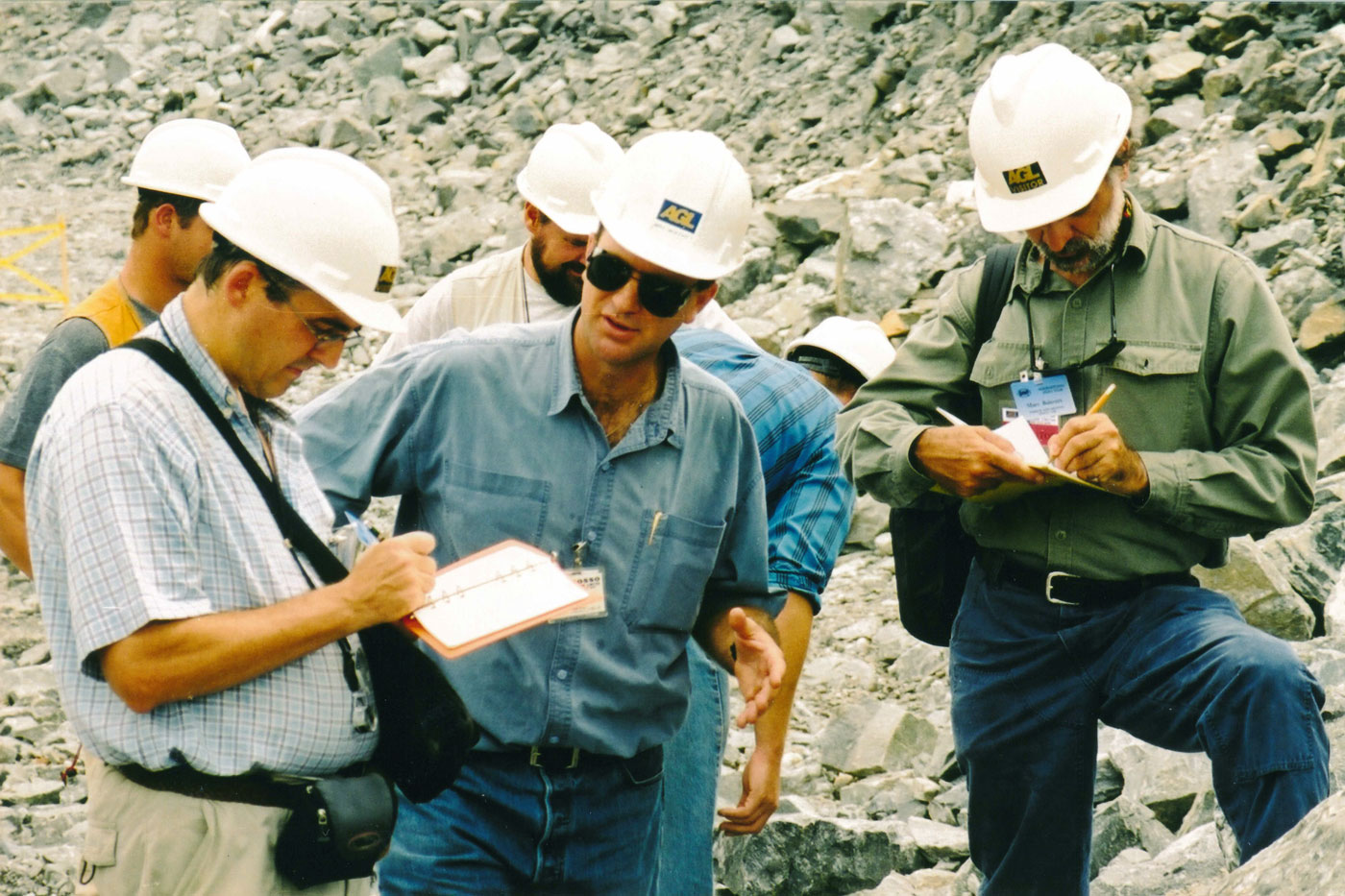 Mike McKevitt (centre) of Abosso Mines explains the geology of the Damang Mine, Ghana.
